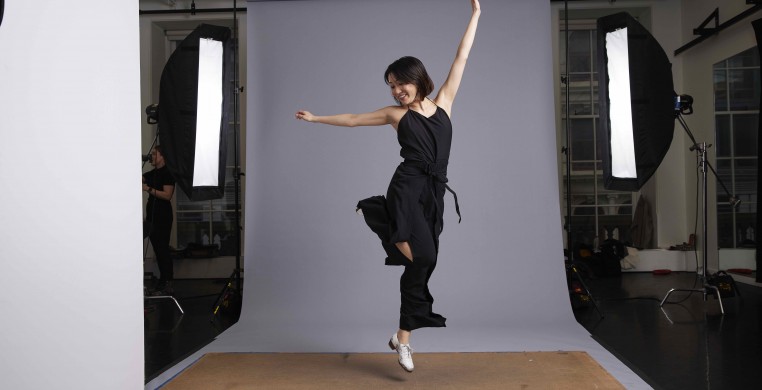 Naomi Funaki dancing on a makeshift stage