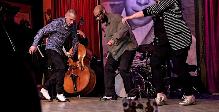 Jumaane Taylor and Jason Janas tap dancing on stage together at the Jazz Showcase
