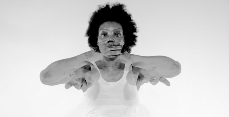 A screen shot of Jenn "Po'Chop" Freeman in "Collage." The dance film is the third in a series of five called "Litany," accompanied by a digital blogzine called "The Brown Pages."