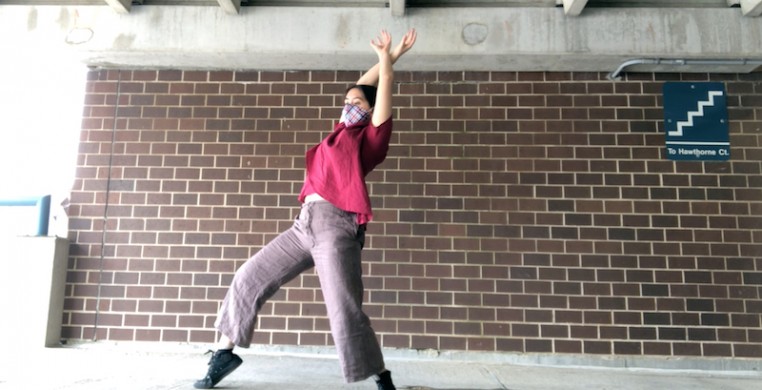 Julianna Hom performing her solo "AMERICANIZATION" in a parking garage. Screen shot courtesy of the artist