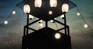 Night Festival scene with Japanese Lanterns stream off of a Yagura 