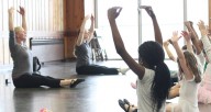Ballet students stretch on the floor during Synapse Arts ballet class at Loyola Park